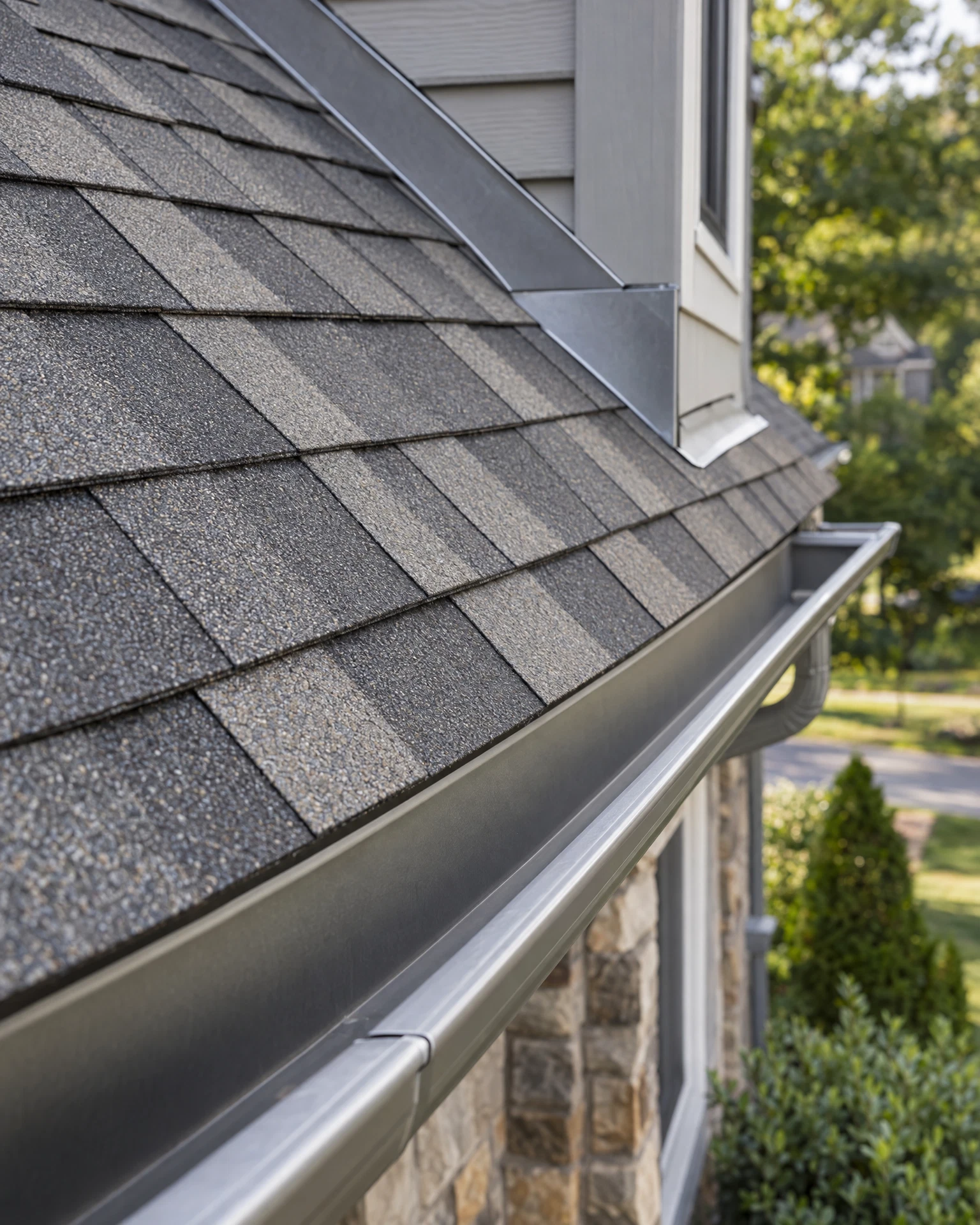 Residential roofing shingles, flashing, and gutter detail